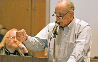 Former Gallup Mayor Emmett Garcia gestures with his hand indicating the way a gun was used on him as recounts his experiences to an audience at UNM-Gallup's Calvin Hall, talking about his kidnapping and the ensuing gun battle between police and two Native American Activists, Larry Casuse and Robert Nakaidene, in March of 1973. Casuse was killed during the incident and Garcia still has 56 shotgun pellets in his body from being shot by Nakaidene. Garcia said, "They had justification for doing some things. Not for capturing and trying to kill the mayor." Copyright © 2010 Gallup Independent